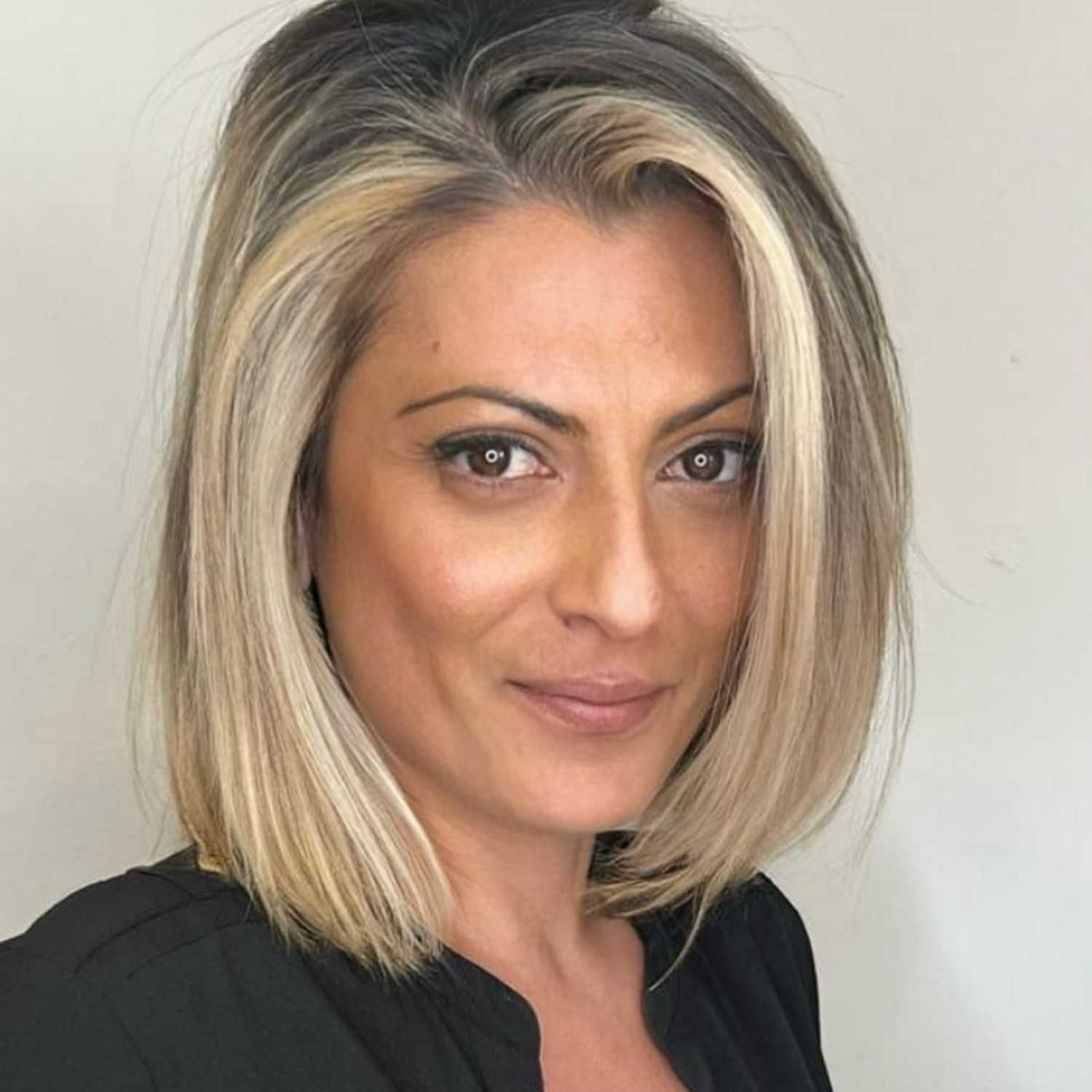 Portrait of Irene, a professional stylist at [salon] 718, showcasing their expertise and style.