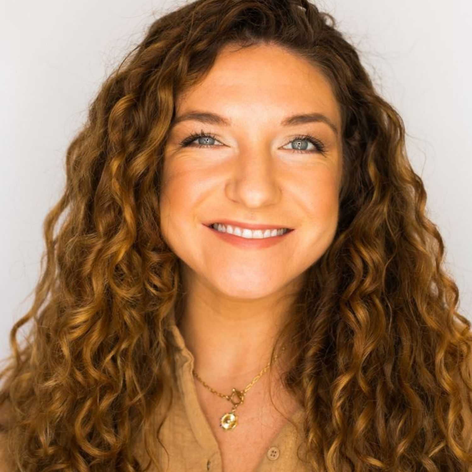 Portrait of Sarah, a professional stylist at [salon] 718, showcasing their expertise and style.