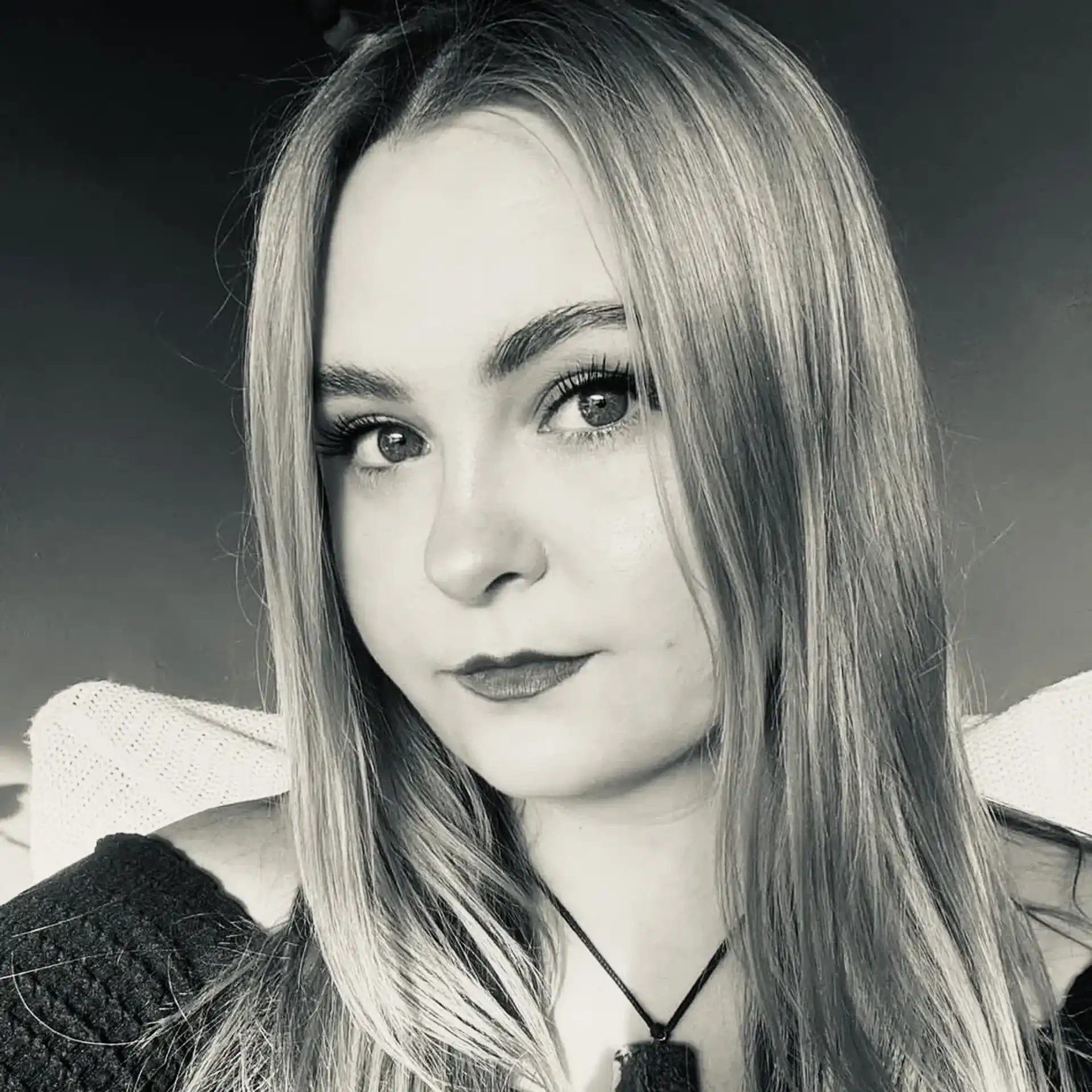 Portrait of Chynna Cline, a professional stylist at Salon Savoir, showcasing their expertise and style.