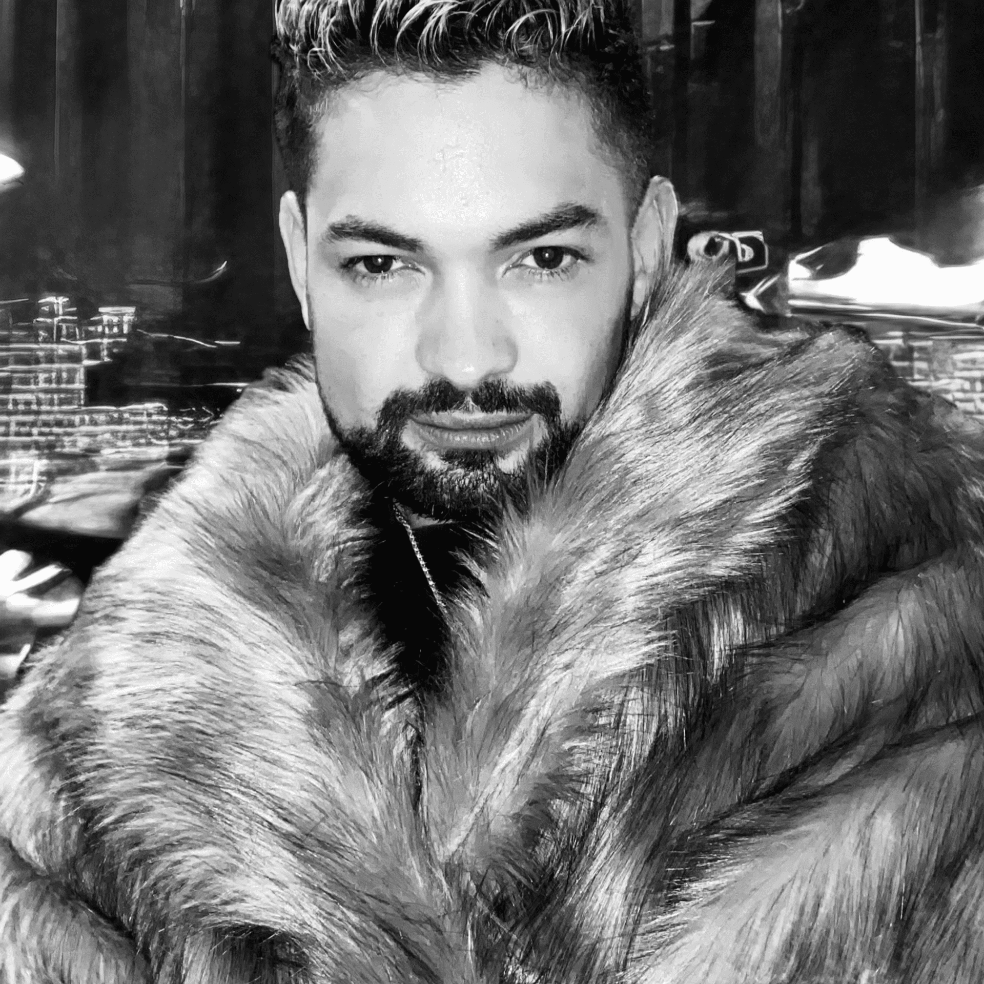 Portrait of Sergio Viana, a professional stylist at Salon Savoir, showcasing their expertise and style.