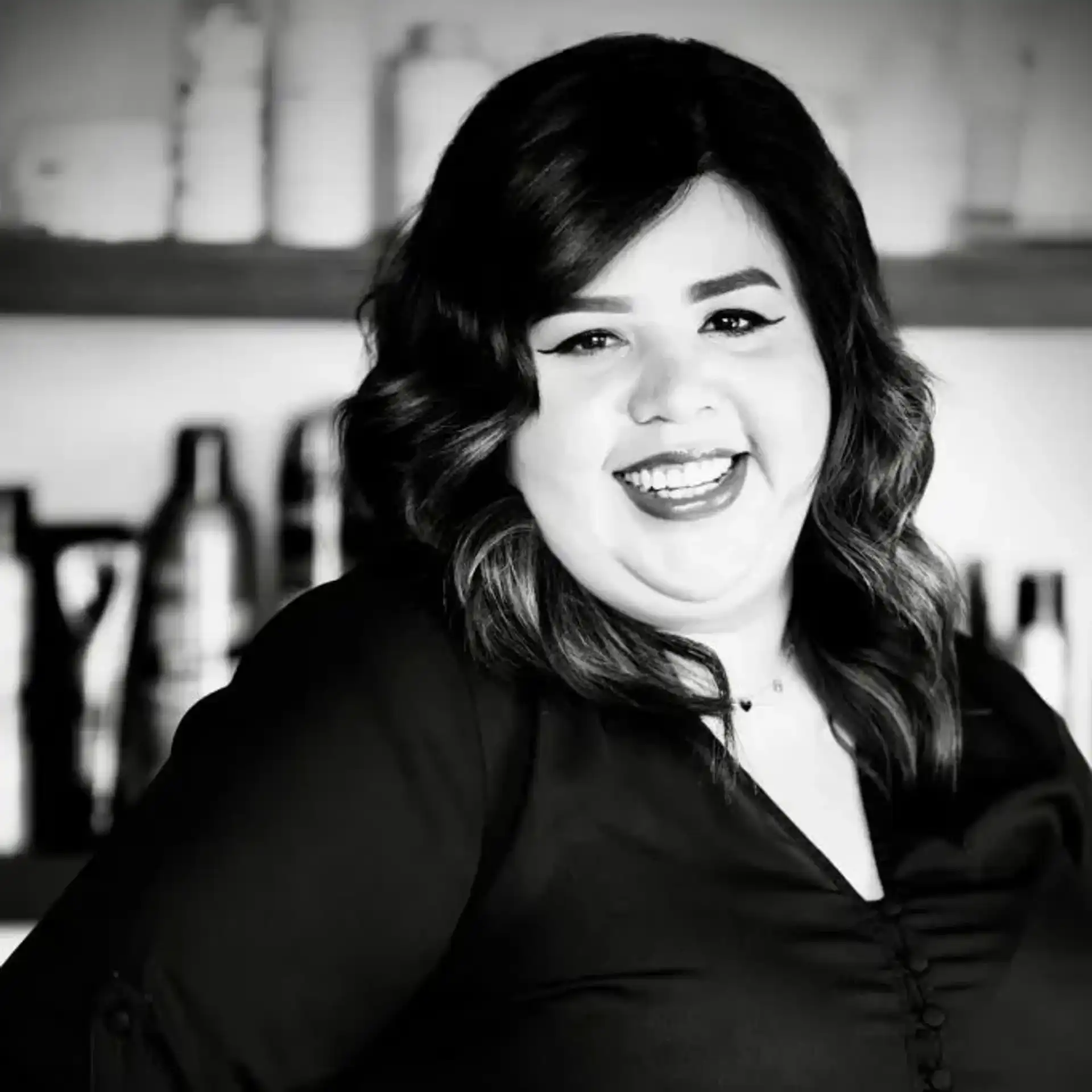 Portrait of Ana Romero, a professional stylist at Salon Savoir, showcasing their expertise and style.