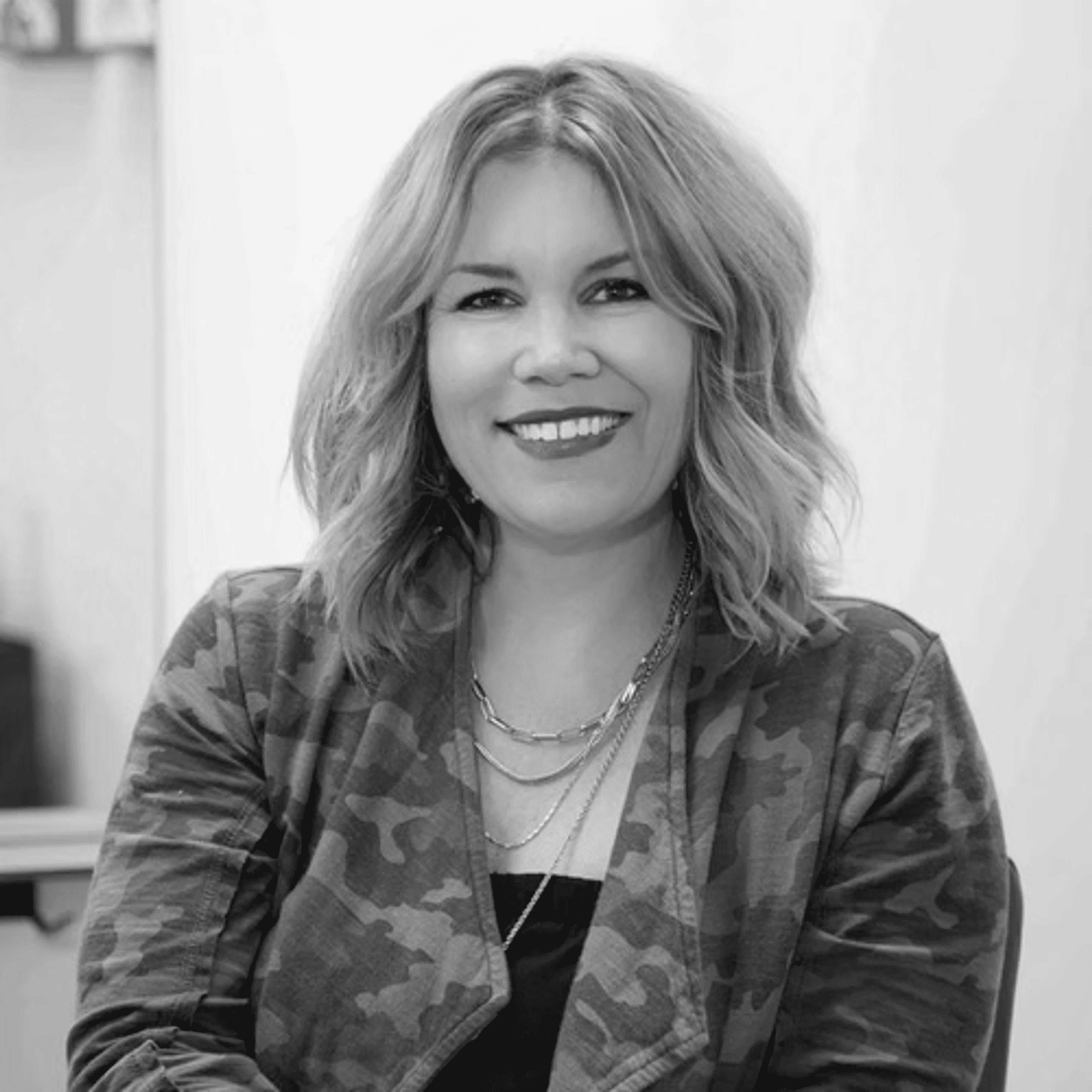 Portrait of Michelle Ward, a professional stylist at Salon Savoir, showcasing their expertise and style.