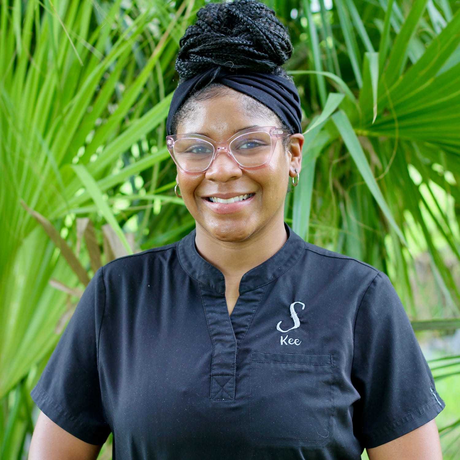 Portrait of Kechawna (Kee), a professional stylist at Scarborough's Salon & Day Spa, showcasing their expertise and style.
