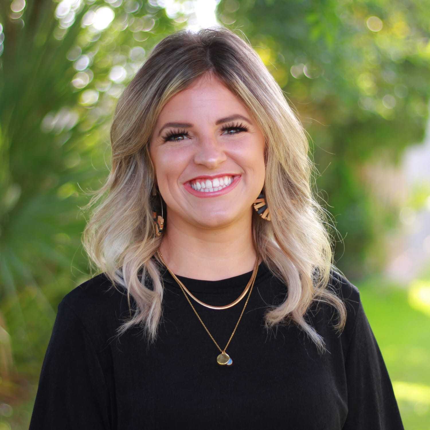 Portrait of Tristin, a professional stylist at Scarborough's Salon & Day Spa, showcasing their expertise and style.