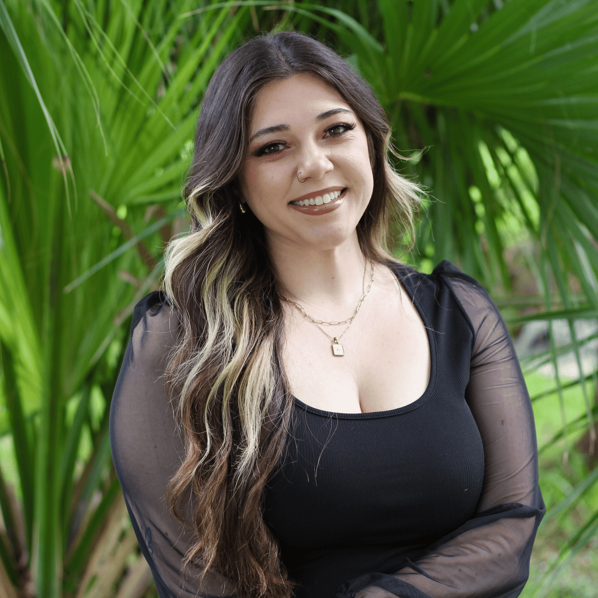 Portrait of Bailen, a professional stylist at Scarborough's Salon & Day Spa, showcasing their expertise and style.