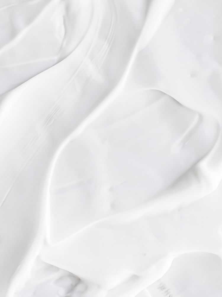 Swirling white cream or cosmetic texture with marble-like pattern.