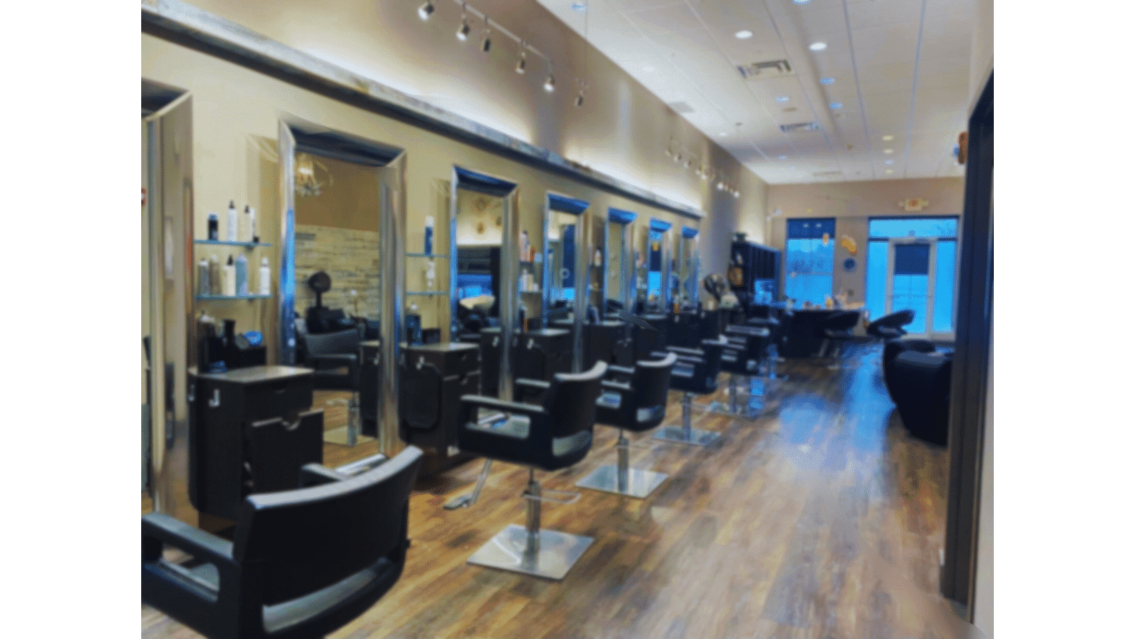 Interior of an empty hair salon with chairs and mirrors.
