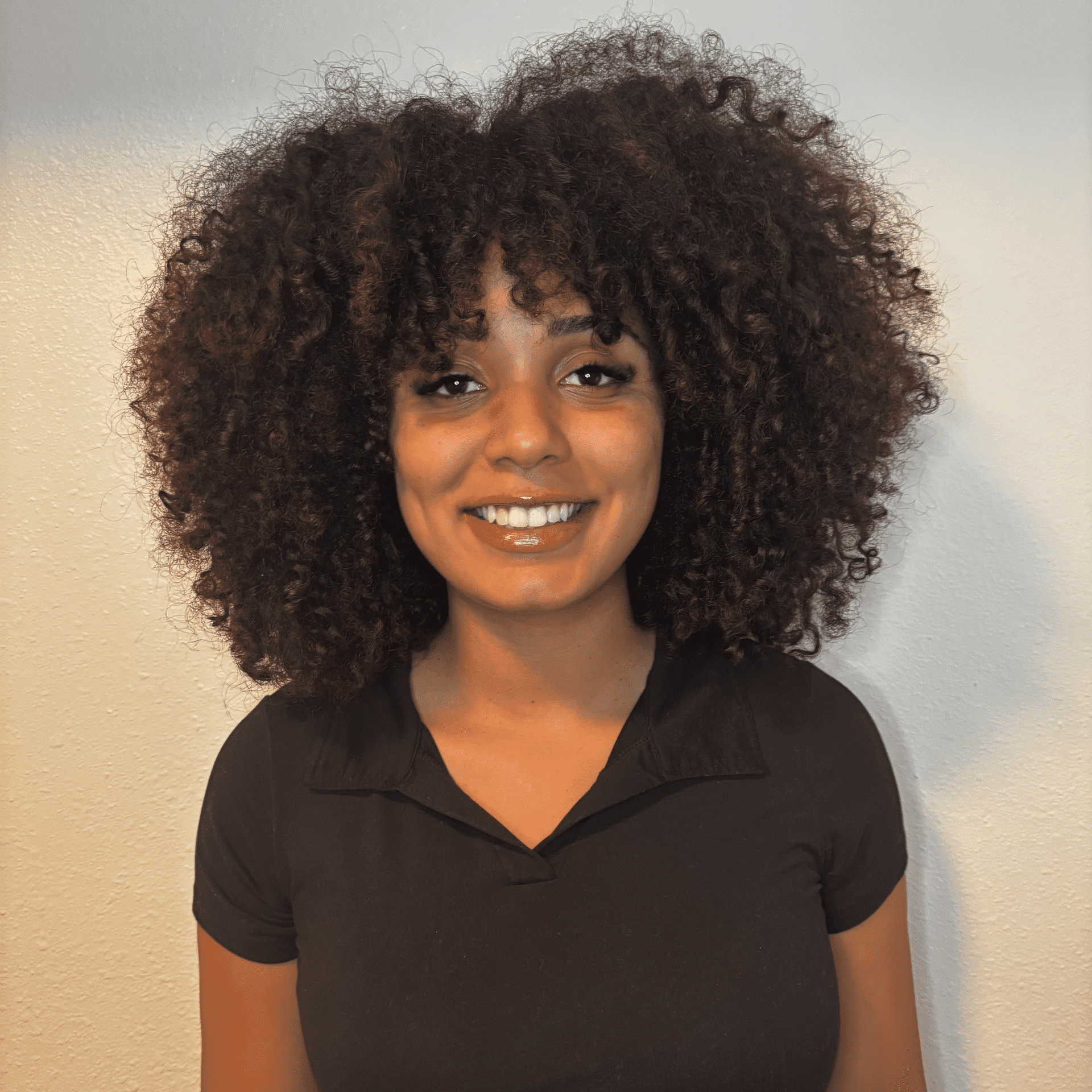 Portrait of Ananda, a professional stylist at Sweet Betty Salon, showcasing their expertise and style.