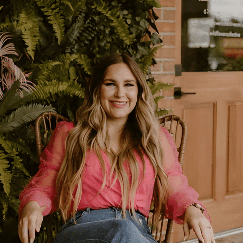 Portrait of Chasity Davenport, a professional stylist at The Wildflower Collective LLC, showcasing their expertise and style.