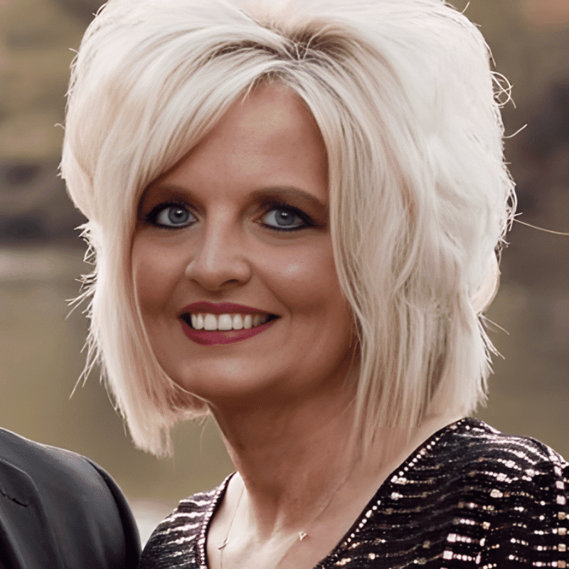 Portrait of Melanie Cox, a professional stylist at The Wildflower Collective LLC, showcasing their expertise and style.